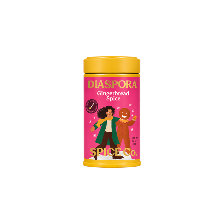 The Tiny Finch Diaspora Gingerbread Spice tin with a pink label featuring a gingerbread man and winter illustration.