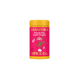 The Tiny Finch Diaspora Pahadi Pink Garlic powder in a vibrant pink cylindrical tin with a yellow lid.
