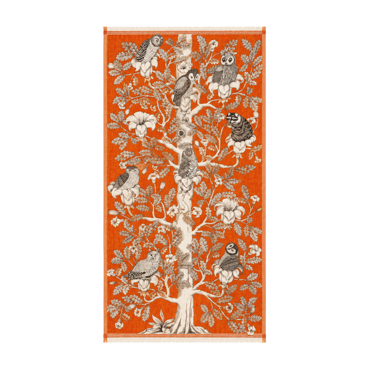 The Tiny Finch Archimede orange wool scarf featuring a detailed black and white owl family tree illustration.