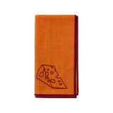 The Tiny Finch orange linen blend napkin with a dark red embroidered cheese wedge pattern and matching border.