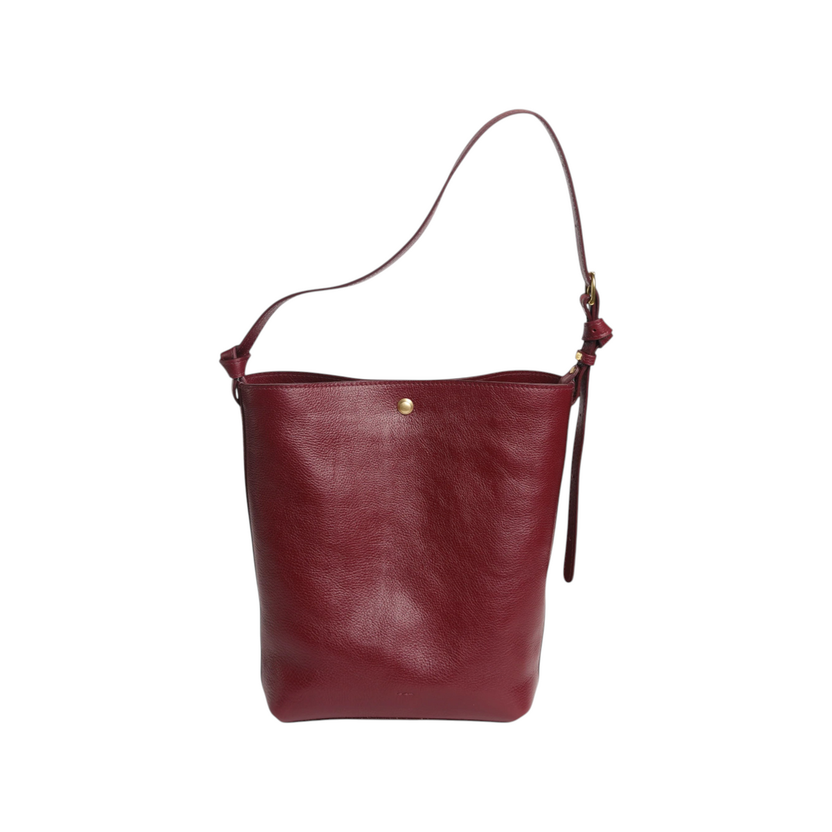 The Tiny Finch Lee Sumac bucket tote in supple vegetable-tanned pebble leather with adjustable strap and brass hardware