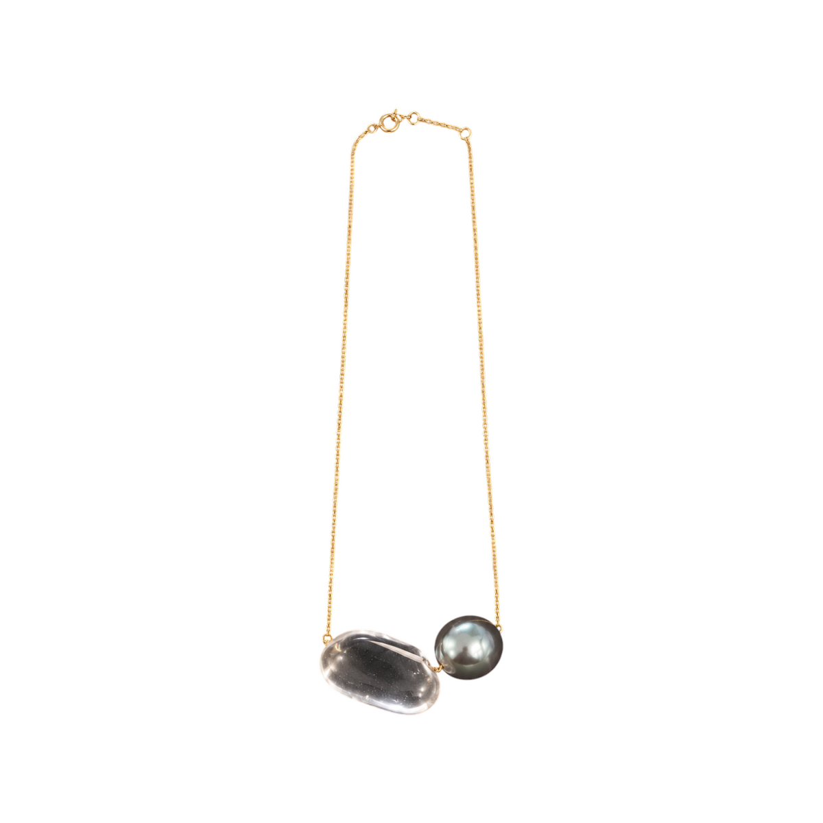The Tiny Finch 18k gold chain necklace featuring a hand-cut crystal tapiz bead and a Tahitian pearl.
