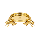 The Tiny Finch Bee Candle Pedestal in polished bronze featuring detailed bee motifs for Trudon classic candles.