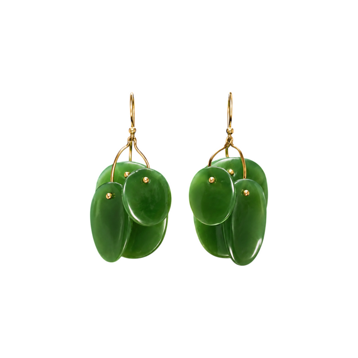 The Tiny Finch jade mobile earrings featuring hand-cut green stone discs on 18k gold ear wires and delicate castings.
