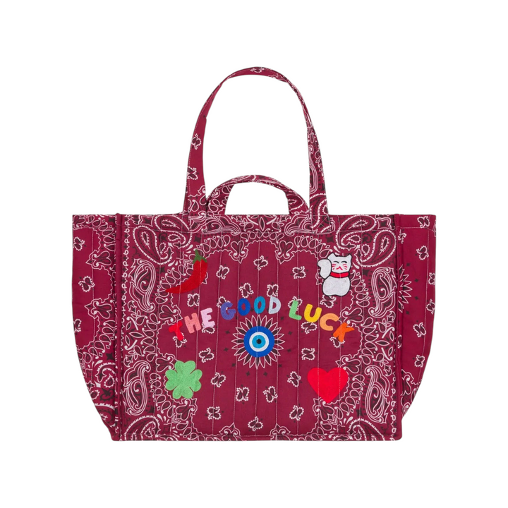 The Tiny Finch bordeaux quilted tote bag with paisley print, embroidered lucky charms, and four carry handles.