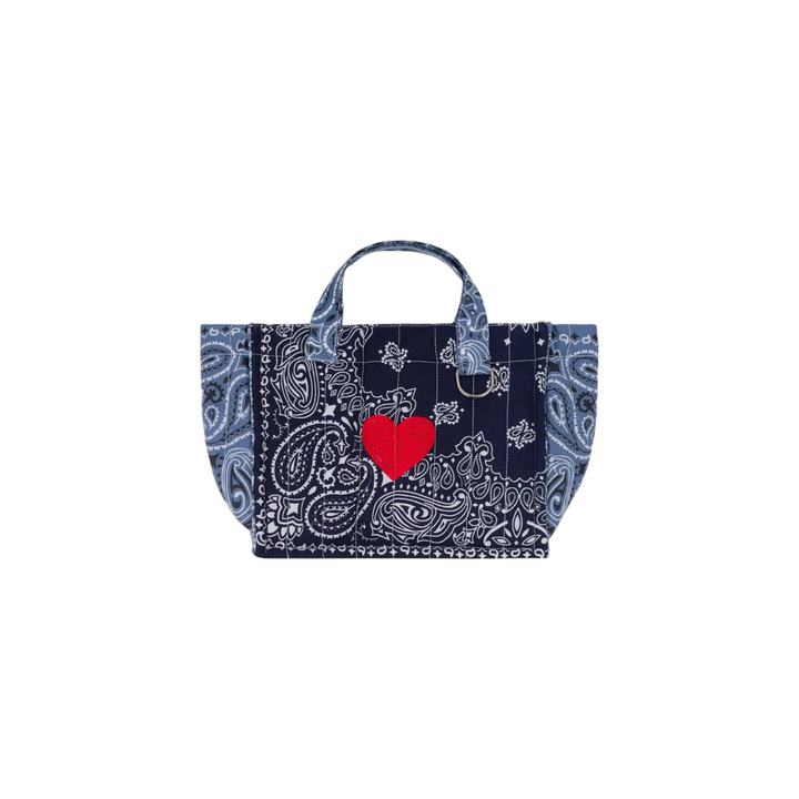 The Tiny Finch navy quilted mini tote bag with white paisley print and a red embroidered heart detail.