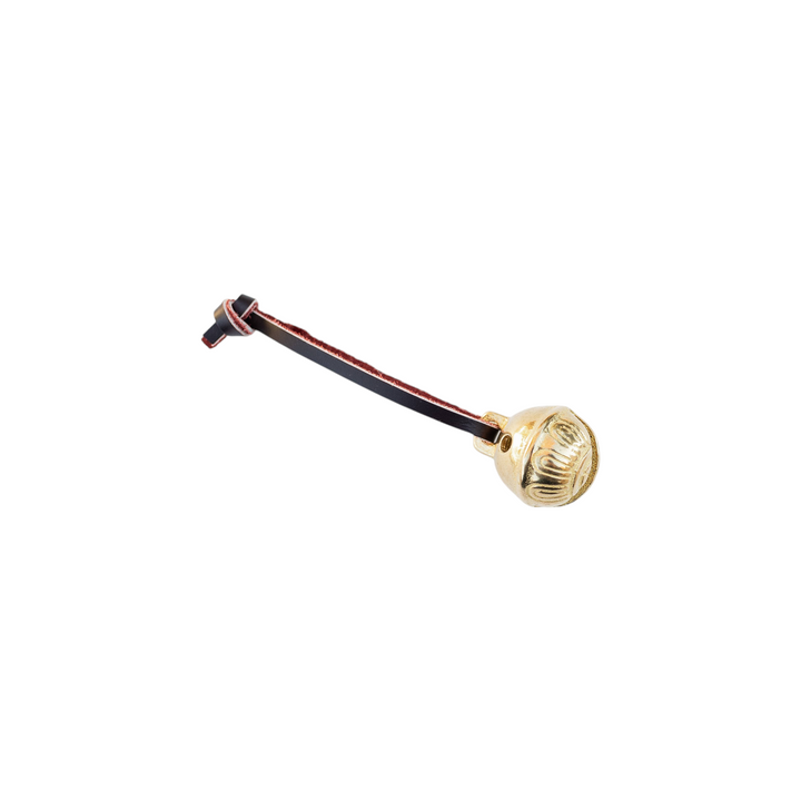 The Tiny Finch solid brass Christmas bell with engraved details and a genuine leather hanging strap