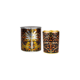 The Tiny Finch Ambra Nera candle in a decorative leopard print glass jar with gold foil details and matching lid.
