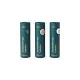 The Tiny Finch aromatherapy nasal inhaler set in dark green paper tubes for nausea, calm, and labor support.