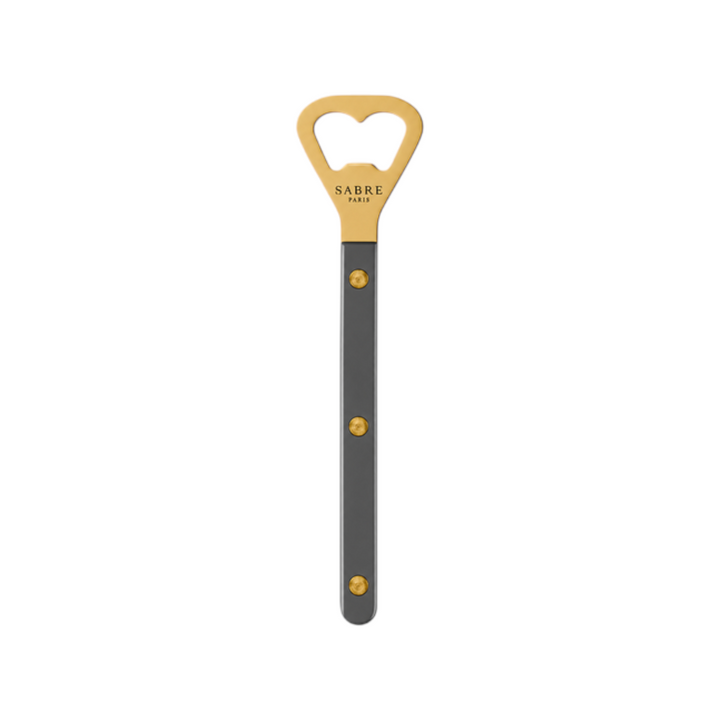 The Tiny Finch Bistro bottle opener featuring a gold-toned head and a dark grey handle with three visible rivets.