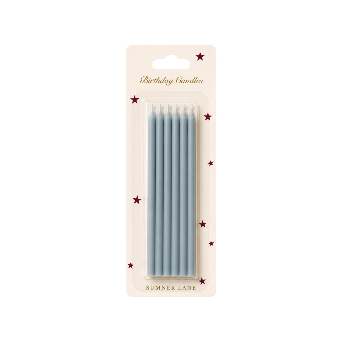 The Tiny Finch set of six slim French blue taper birthday candles in decorative star-patterned packaging.