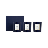 The Tiny Finch Candle Trio Gift Set No. 1 featuring three dark blue glass candles with gold labels in a gift box.