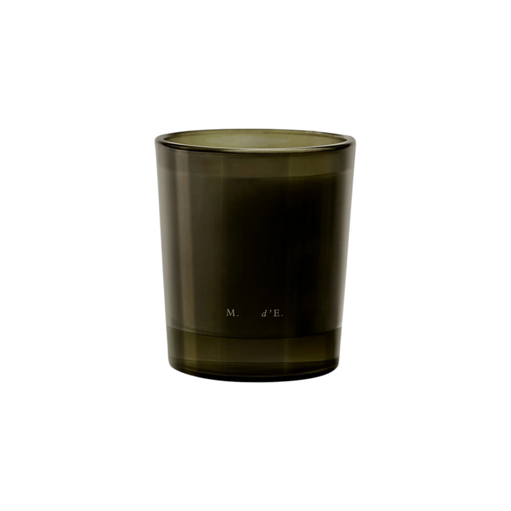 The Tiny Finch Maison d’Etto Macanudo scented candle in a dark olive green glass vessel with minimalist branding.