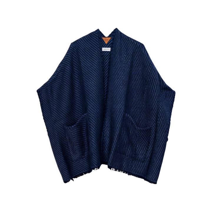 The Tiny Finch navy handwoven merino wool and Tencel cardigan with front pockets and fringe detailing.