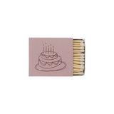 The Tiny Finch matchbox in dusty pink featuring a whimsical brown line-art illustration of a birthday cake.