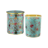 The Tiny Finch Florio candle in a turquoise glass jar with gold foil floral patterns and matching decorative lid