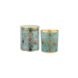 The Tiny Finch Florio candle in a light blue glass jar with gold foil floral patterns and a matching decorative lid