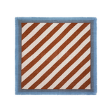 The Tiny Finch Moismont wool scarf in henna and white with diagonal stripes, blue contrast border, and fringed edges.