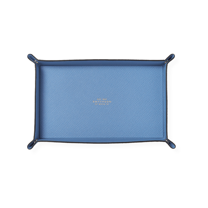 The Tiny Finch blue crossgrain leather rectangular trinket tray with popper corners for desk or bedside organization.