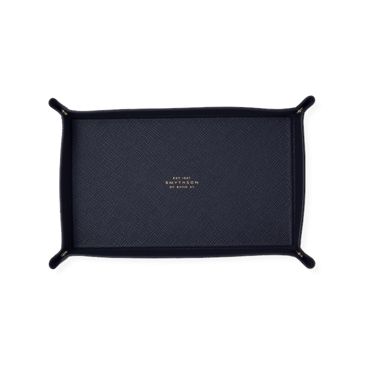 The Tiny Finch navy crossgrain leather rectangular trinket tray with popper fastenings for keys and jewelry.