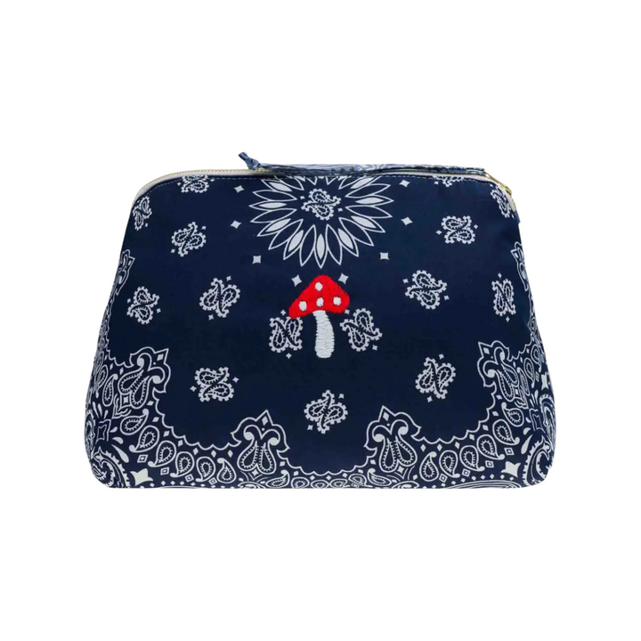 The Tiny Finch large navy blue cotton toiletry bag with white bandana print and hand-embroidered red mushroom detail.