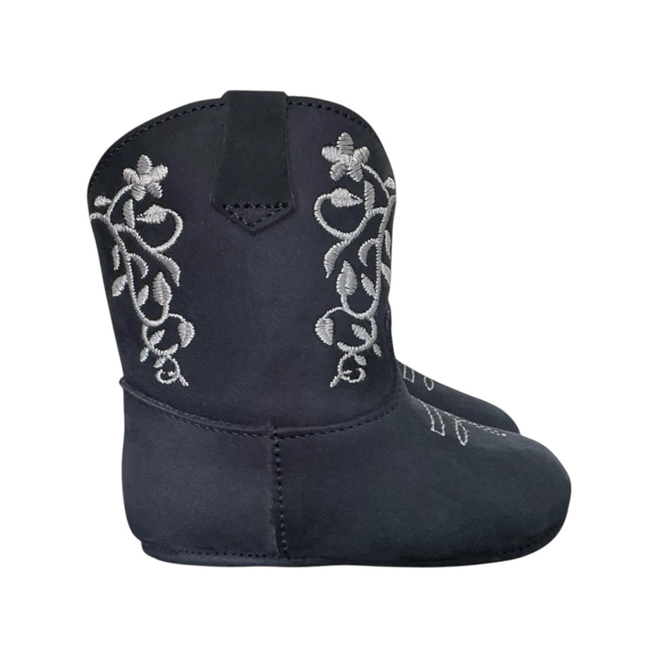 The Tiny Finch navy blue nubuck baby boots featuring delicate gray floral embroidery and a soft sole design.