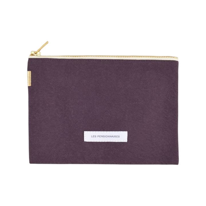 The Tiny Finch eggplant purple organic cotton canvas pouch with a gold zipper and Les Pensionnaires brand label.