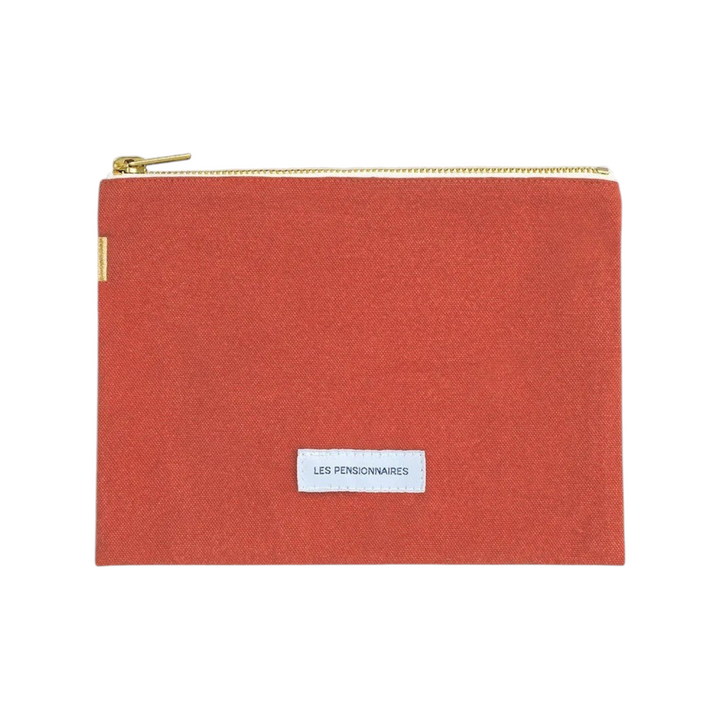 The Tiny Finch Les Pensionnaires small pouch in flamboyant orange organic cotton canvas with a gold zipper closure.