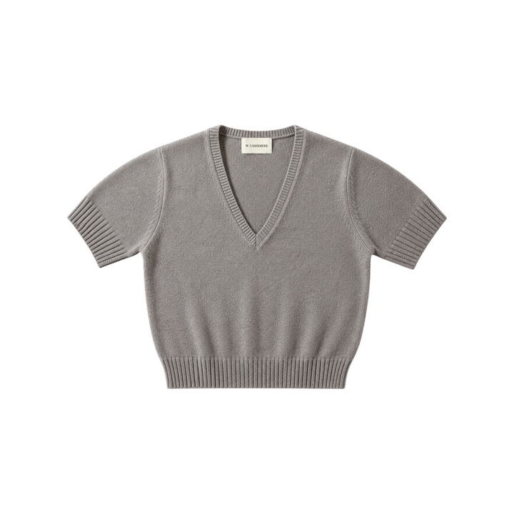 The Tiny Finch W. Cashmere Eira V-neck sweater in stone grey, featuring short sleeves and ribbed hem details.