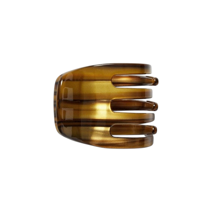 The Tiny Finch mini hair claw clip in a brown tiger's eye patterned Italian bio-acetate finish.
