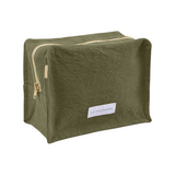 The Tiny Finch Capre green organic cotton canvas toiletry bag with a gold zipper and rectangular cube shape.