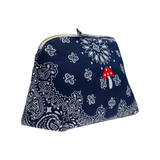 The Tiny Finch large navy cotton toiletry bag with white bandana print and hand-embroidered red mushroom detail.