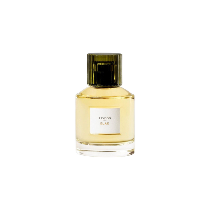 The Tiny Finch Elae perfume in a clear glass bottle with a dark green ribbed cap and golden liquid fragrance.