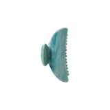The Tiny Finch midi hair claw clip in jadeite green Italian acetate with a double-walled design.