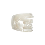 The Tiny Finch mini hair claw clip in a pearlescent white shell bio-acetate finish for all hair types.