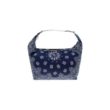 The Tiny Finch navy blue cotton Mini Berlingot bag featuring a white bandana print and adjustable snap handle.