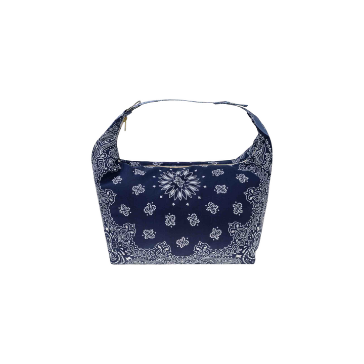 The Tiny Finch navy blue cotton Mini Berlingot bag featuring a white bandana print and adjustable snap handle.