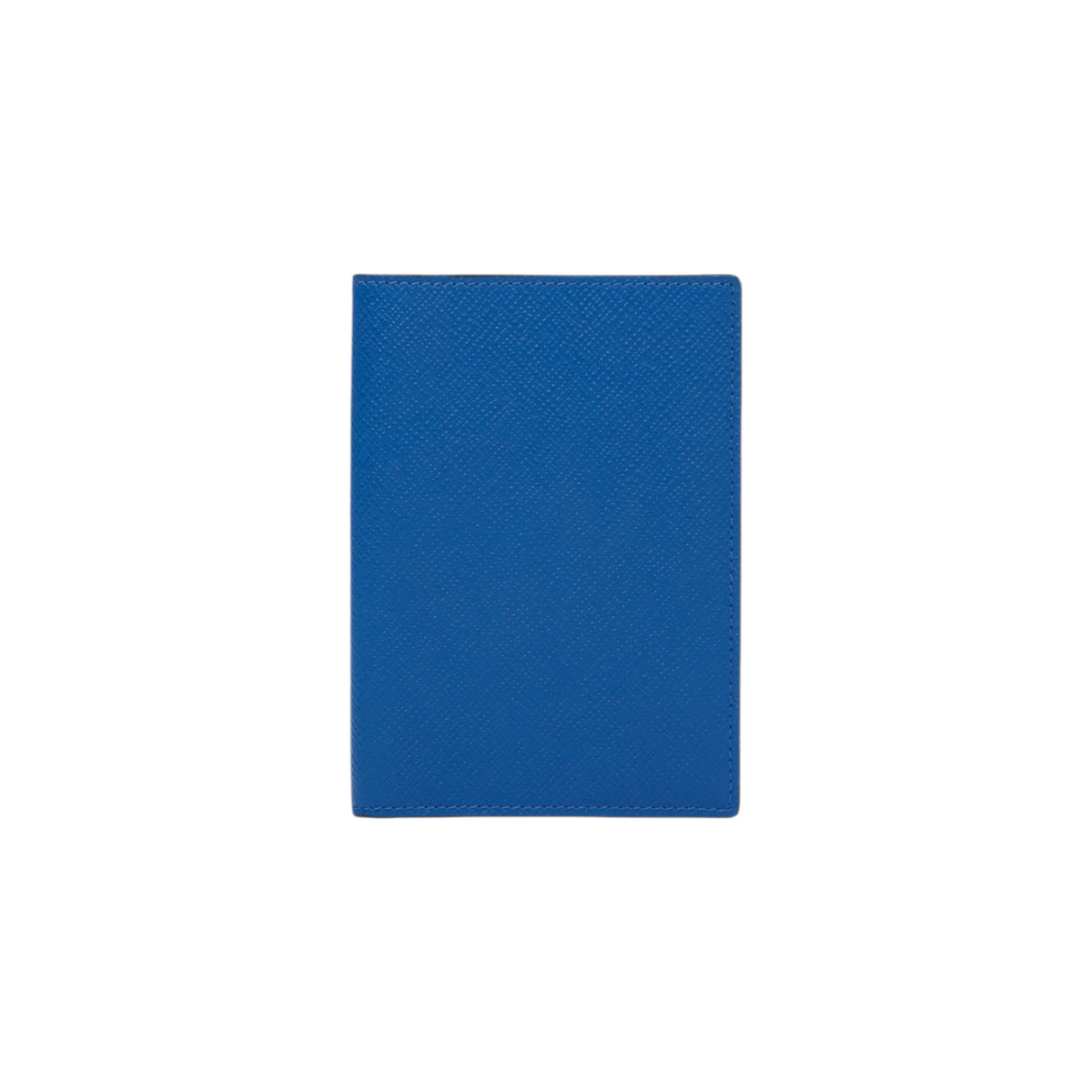 The Tiny Finch cerulean blue crossgrain leather passport cover with a sleek, minimalist design.