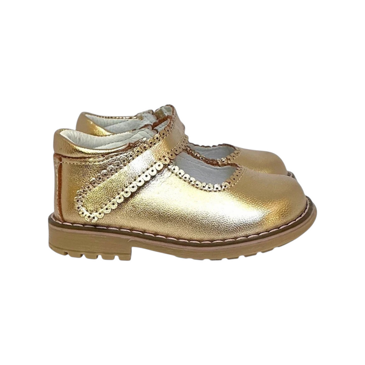 The Tiny Finch Sophie toddler shoe in metallic gold genuine leather with scalloped trim and a sturdy rubber sole.
