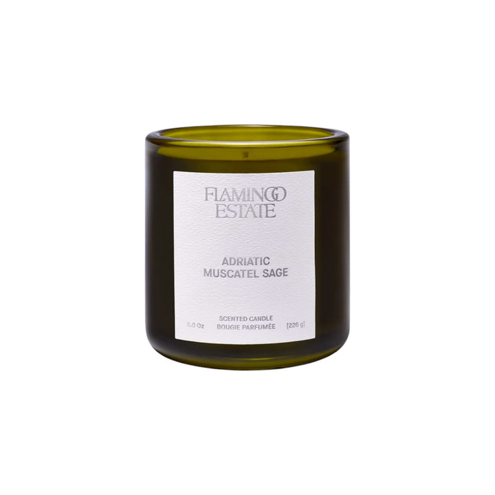 The Tiny Finch Adriatic Muscatel Sage scented candle in a dark green glass jar with a white textured label.