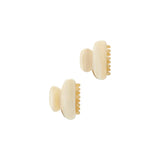 The Tiny Finch alabaster petite hair claws in double-walled Italian acetate with stainless steel hardware.