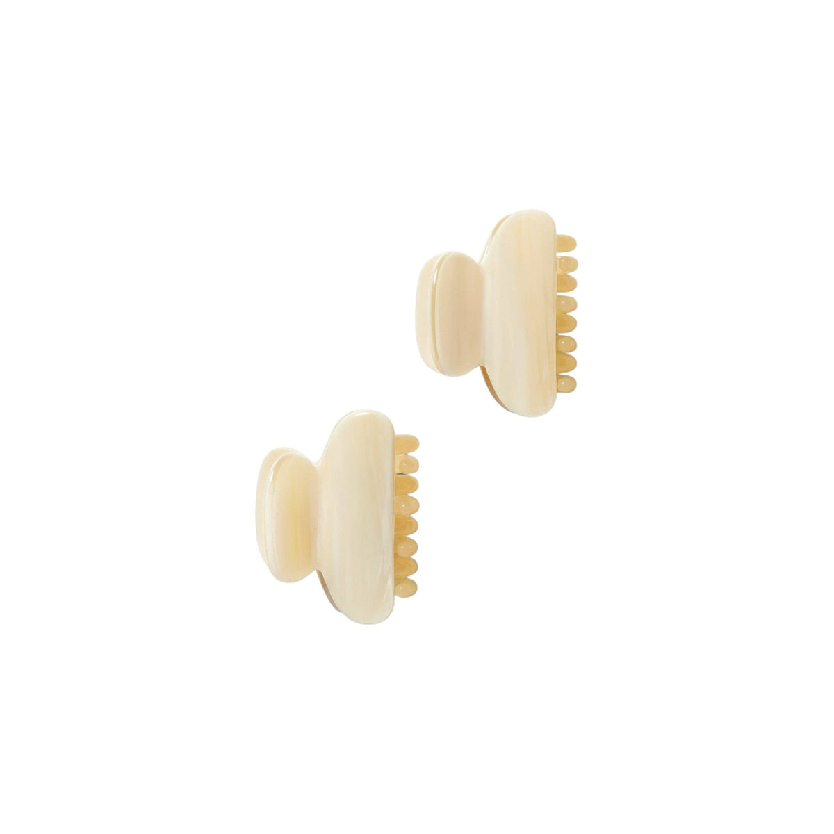 The Tiny Finch alabaster petite hair claws in double-walled Italian acetate with stainless steel hardware.