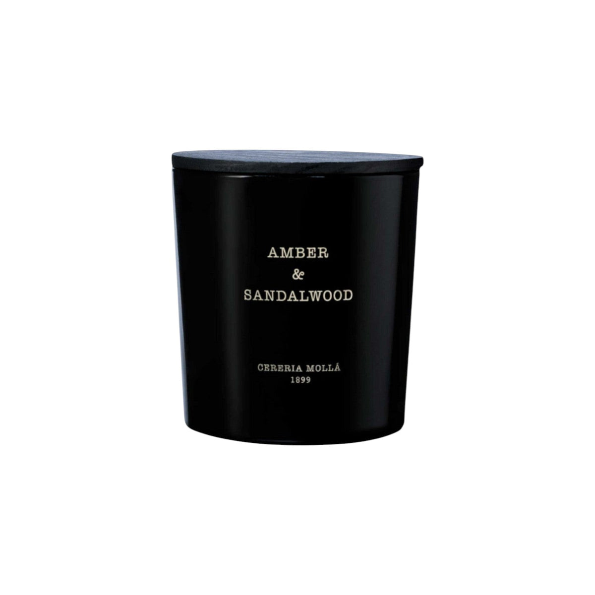 The Tiny Finch Amber & Sandalwood 3-wick candle in a black hand-painted glass vase with a matching wooden lid.