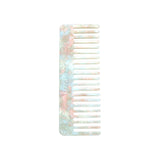 The Tiny Finch wide-tooth comb in Astral Mint, handcrafted from marbled Italian acetate for all hair types.