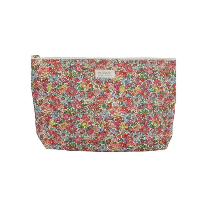 The Tiny Finch Augustine baby toiletry bag in a colourful floral Liberty London cotton fleece print with brass zipper