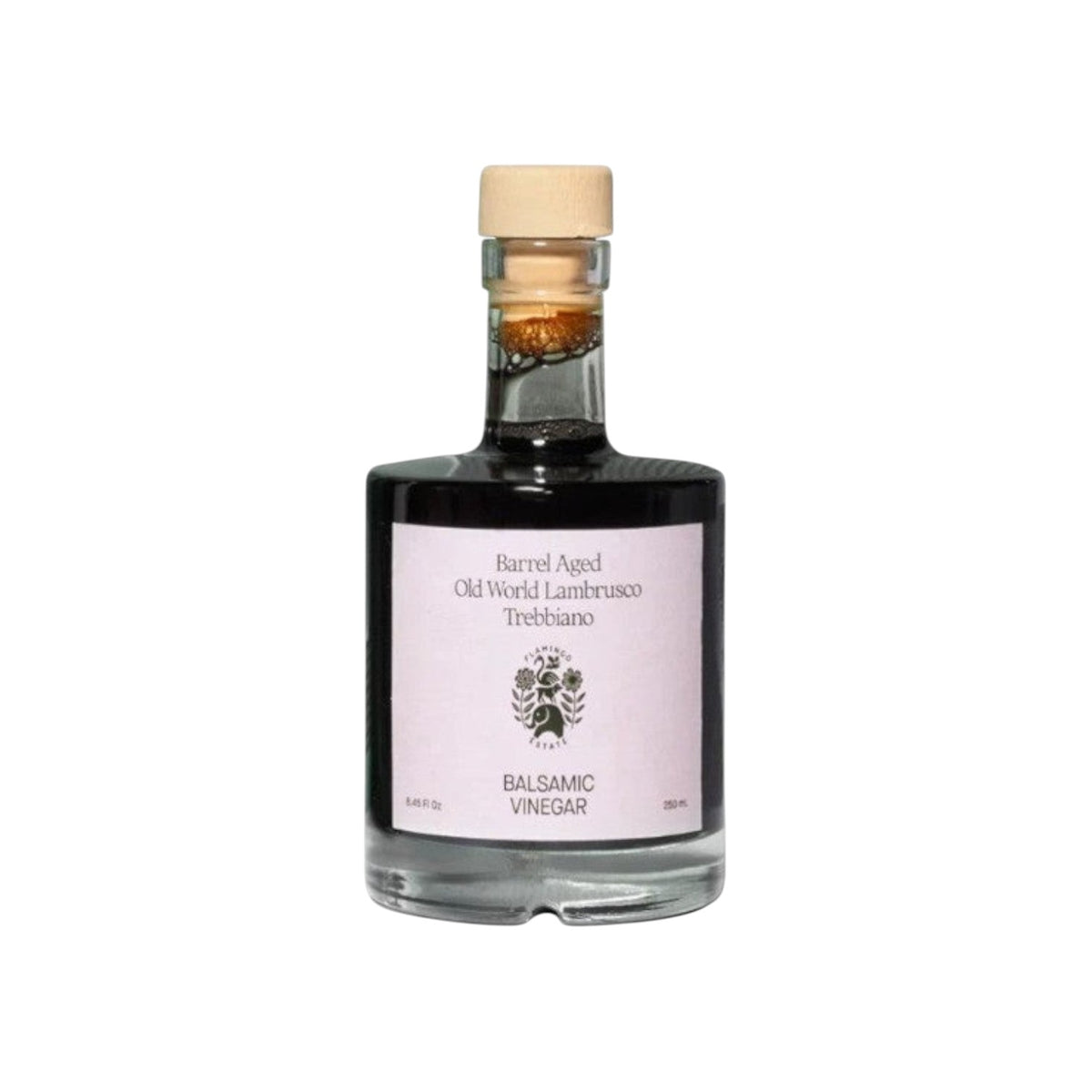 The Tiny Finch barrel-aged balsamic vinegar in a glass bottle with a wooden cork stopper and minimalist label.
