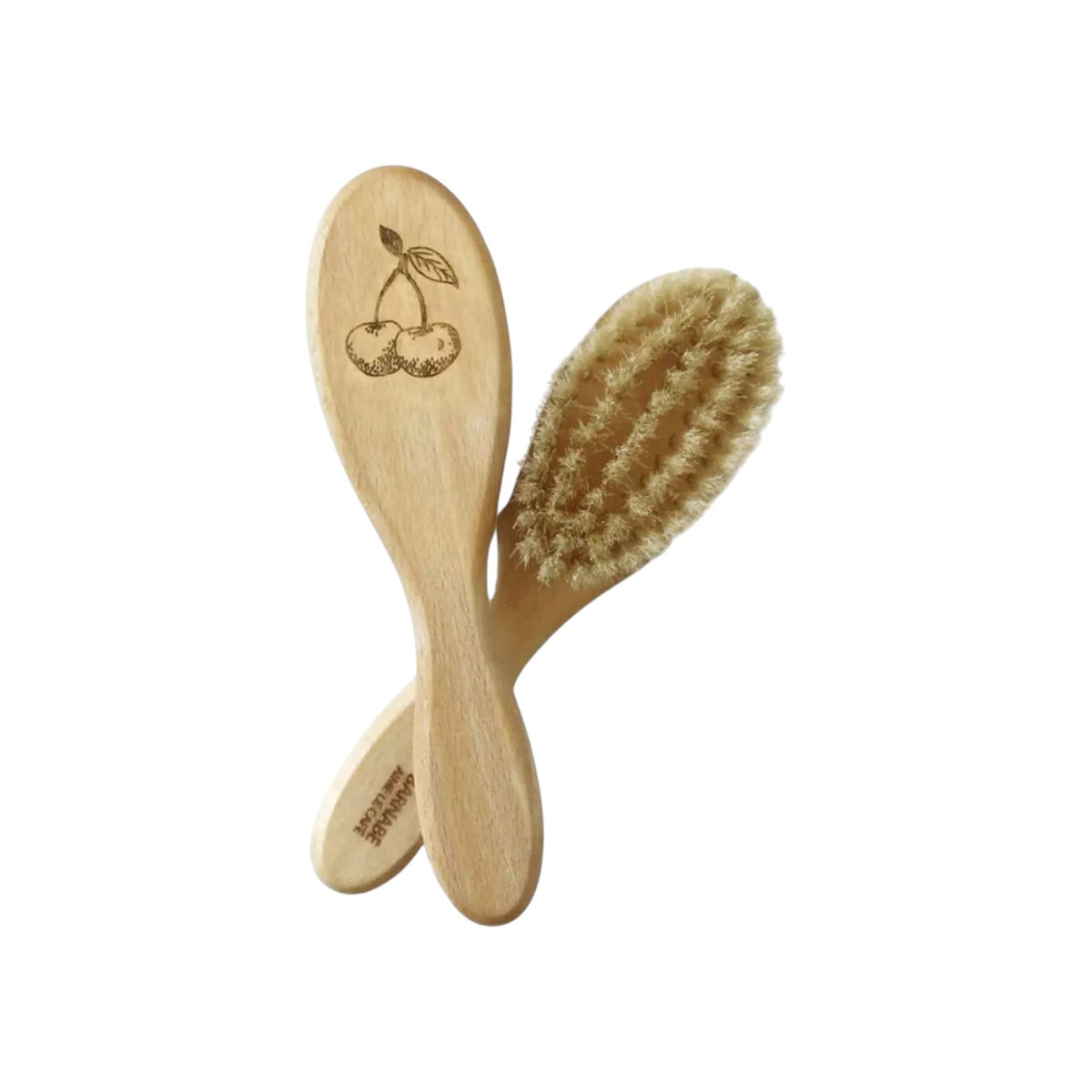 The Tiny Finch baby hairbrush made of beech wood with soft white silk bristles and a cherry illustration