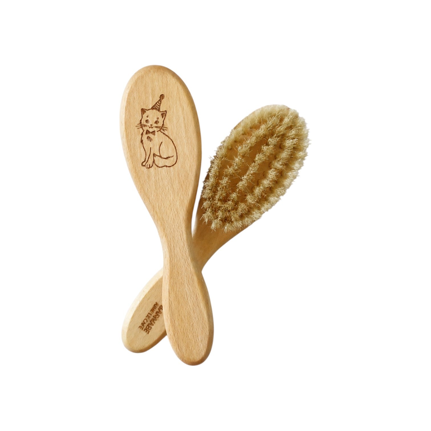 The Tiny Finch baby hairbrush made of oiled beech wood with soft white silk bristles and a cute cat illustration.