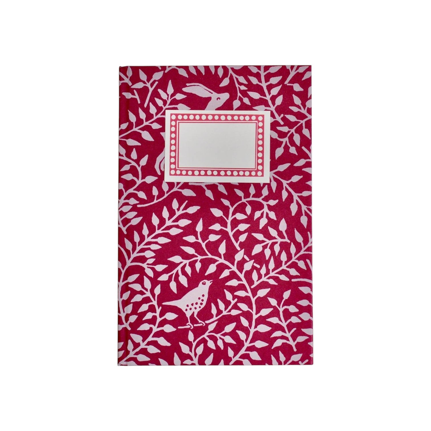 The Tiny Finch hardback notebook in berry red with a white dancing hare and bird pattern and a blank cream label.