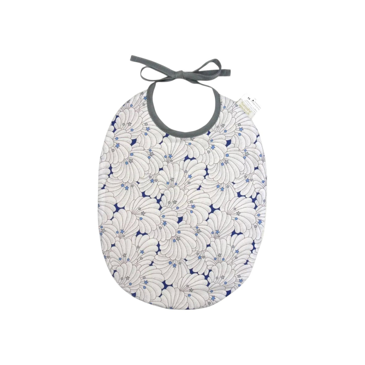 The Tiny Finch Bib Como featuring a white and blue shell pattern on OEKO-TEX Liberty fabric with grey tie closure.
